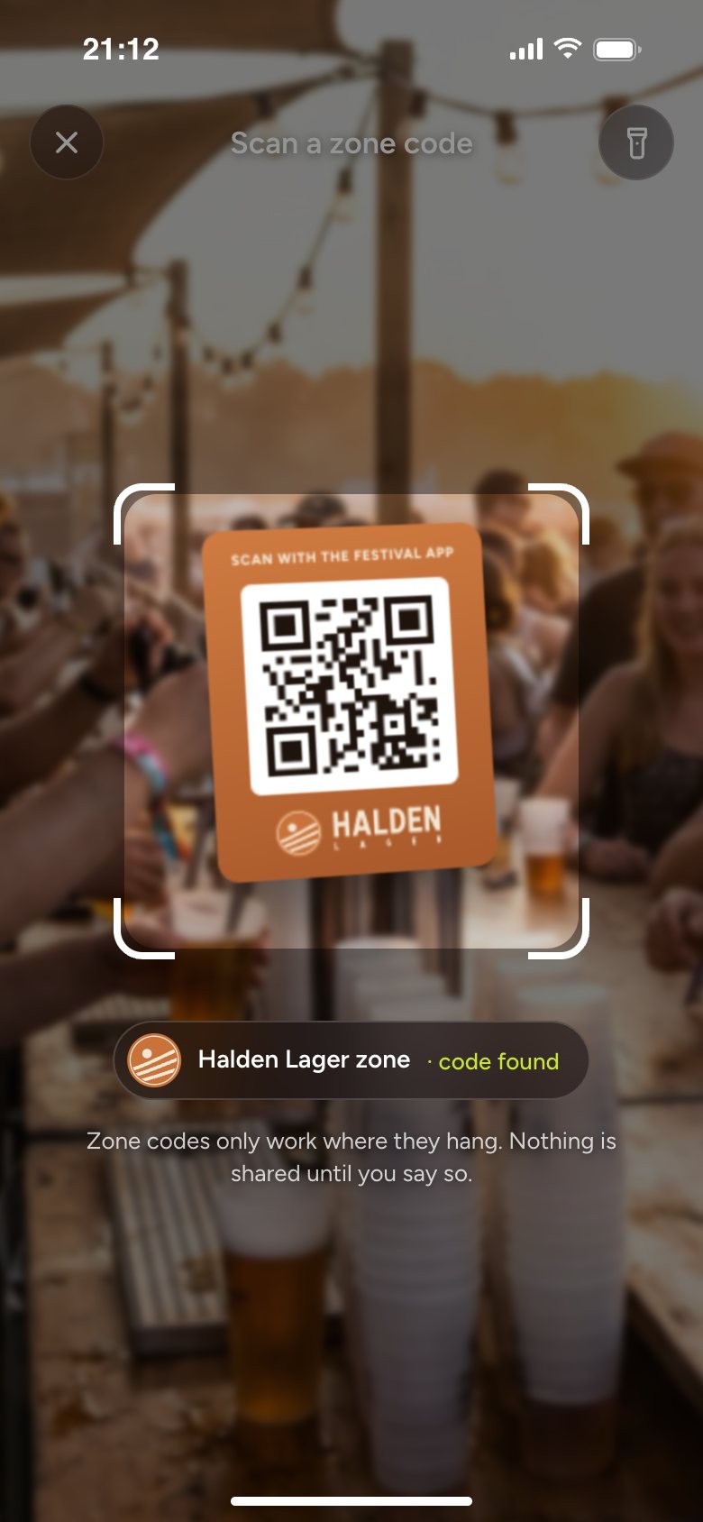The festival app's scanner over the code at the sponsor's bar